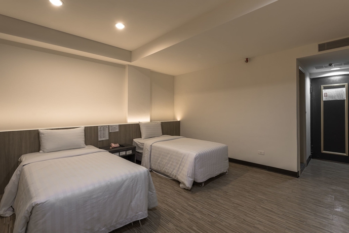 Imagen de la habitación del Hotel Lotus Yuan Business. Foto 7