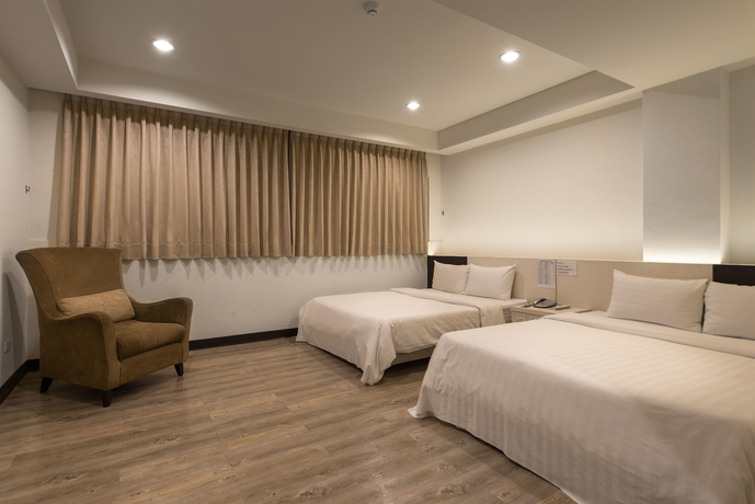 Imagen de la habitación del Hotel Lotus Yuan Business. Foto 8