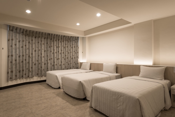 Imagen de la habitación del Hotel Lotus Yuan Business. Foto 9