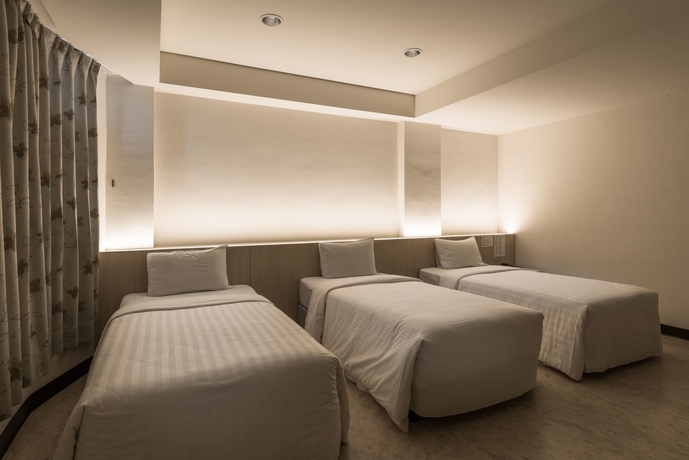 Imagen de la habitación del Hotel Lotus Yuan Business. Foto 10