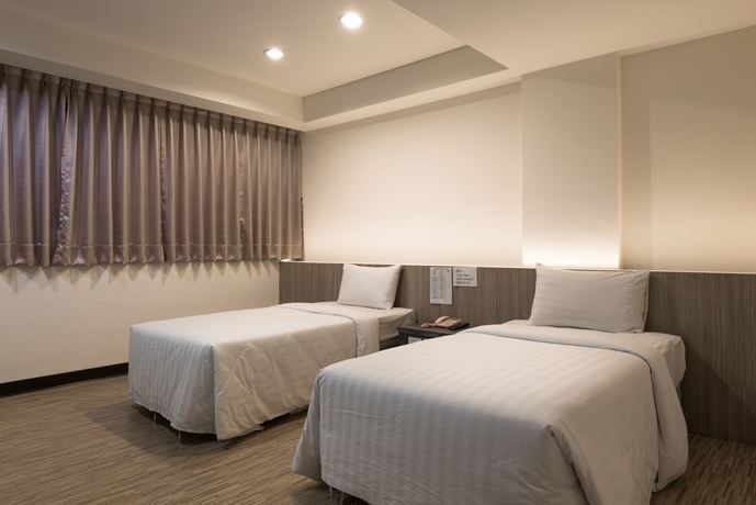 Imagen de la habitación del Hotel Lotus Yuan Business. Foto 11