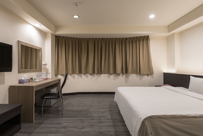 Imagen de la habitación del Hotel Lotus Yuan Business. Foto 13