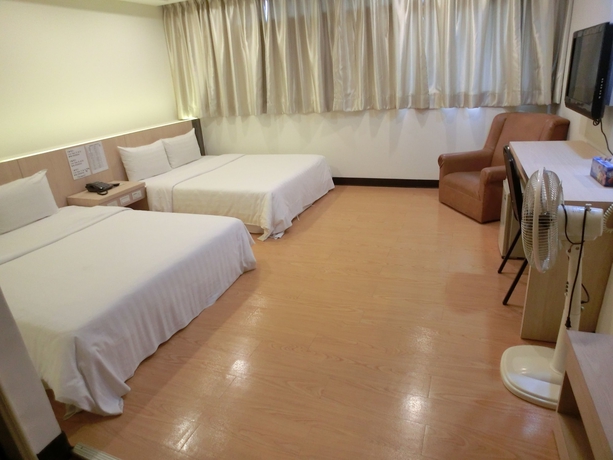Imagen de la habitación del Hotel Lotus Yuan Business. Foto 15