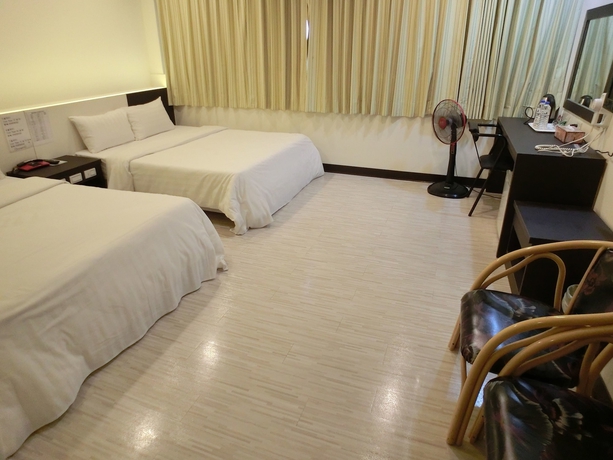 Imagen de la habitación del Hotel Lotus Yuan Business. Foto 16