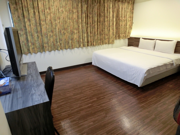 Imagen de la habitación del Hotel Lotus Yuan Business. Foto 18