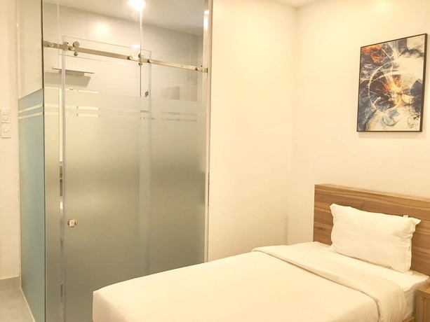 Imagen de la habitación del Hotel Louis Hotel - Bui Vien Walking Street. Foto 2