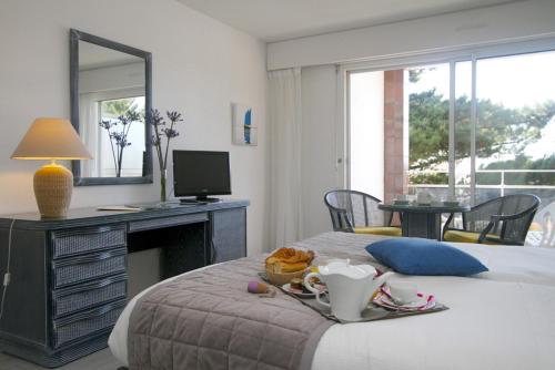 Imagen de la habitación del Hotel Louison Appart & Suite. Foto 6