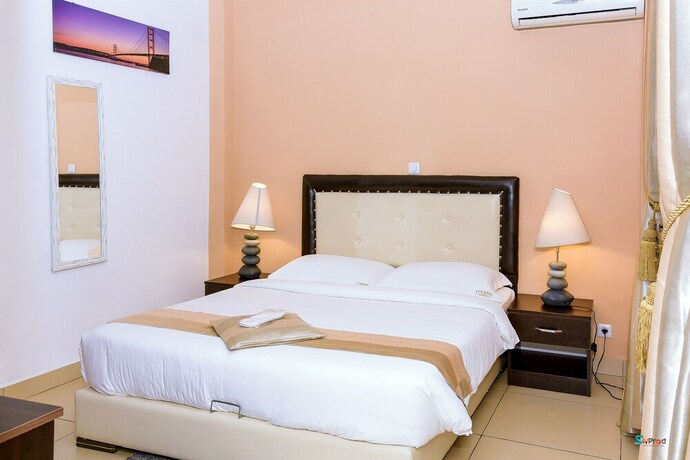 Imagen de la habitación del Hotel Loumia Residency. Foto 17