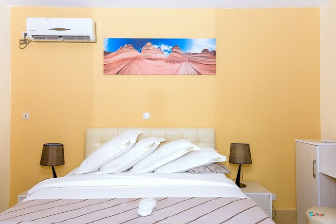 Imagen de la habitación del Hotel Loumia Residency. Foto 22