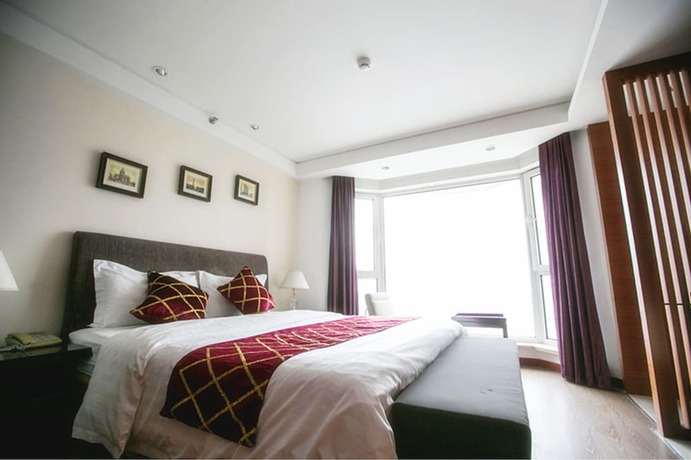 Imagen de la habitación del Hotel Love Holiday Inn apartment. Foto 2