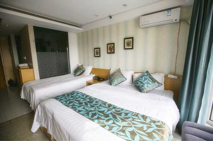 Imagen de la habitación del Hotel Love Holiday Inn apartment. Foto 10