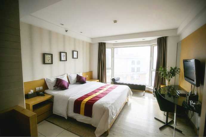 Imagen de la habitación del Hotel Love Holiday Inn apartment. Foto 13