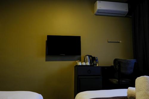 Imagen de la habitación del Hotel Loyalcity. Foto 20