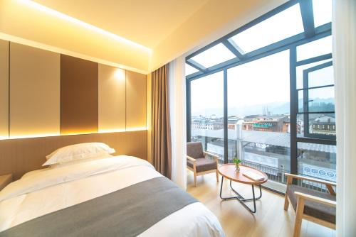 Imagen de la habitación del Hotel Lucky Praised Scenery. Foto 17