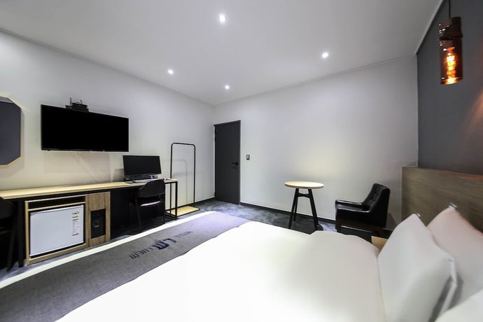 Imagen de la habitación del Hotel Luem. Foto 14