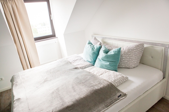 Imagen de la habitación del Hotel Luga Homes – Stadthaus. Foto 11