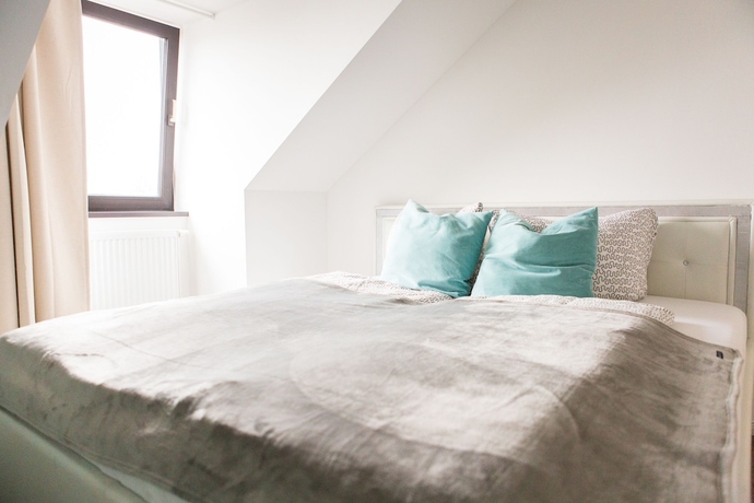 Imagen de la habitación del Hotel Luga Homes – Stadthaus. Foto 12