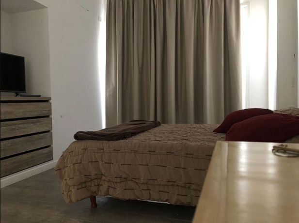 Imagen de la habitación del Hotel Lujan Homes. Foto 7
