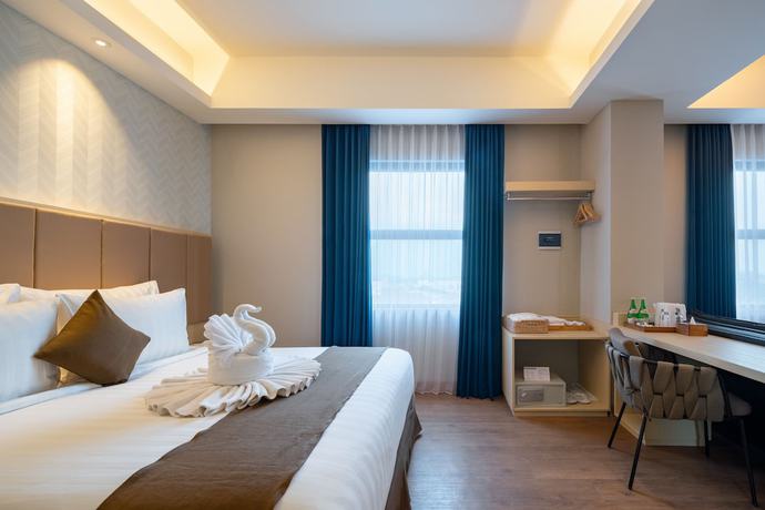 Imagen de la habitación del Hotel Luminor Aiport Sidoarjo. Foto 12