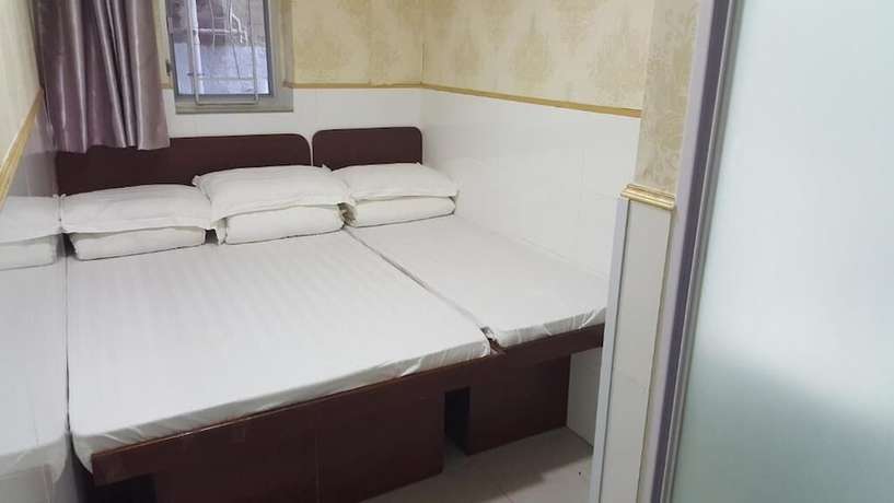 Imagen de la habitación del Hotel Lung Wa. Foto 11
