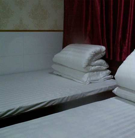 Imagen de la habitación del Hotel Lung Wa. Foto 20