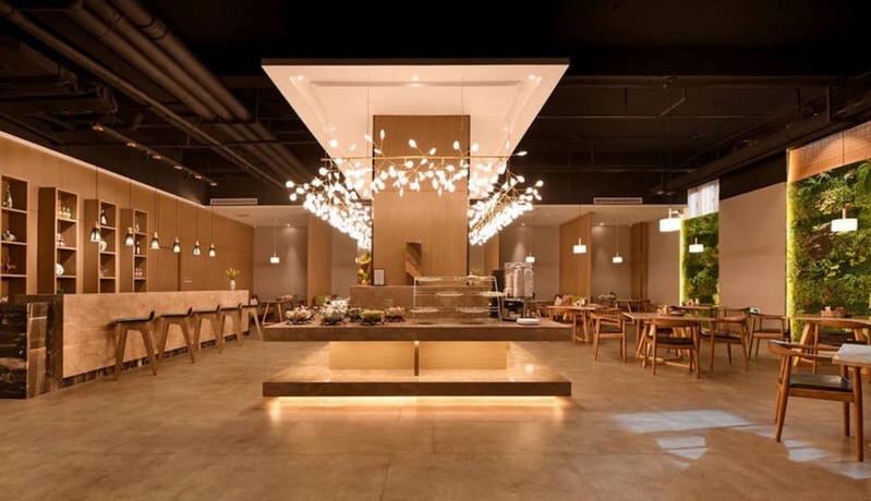 Imagen del bar/restaurante del Hotel Luoyang Mehood Lestie Xiyuan. Foto 3