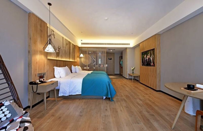 Imagen de la habitación del Hotel Luoyang Mehood Lestie Xiyuan. Foto 13