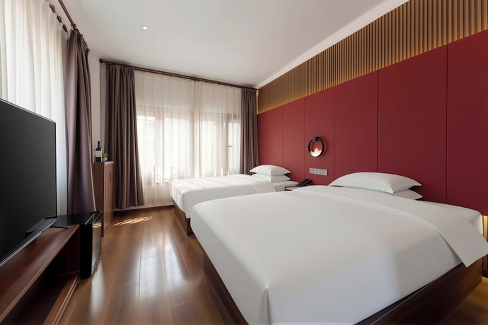 Imagen de la habitación del Hotel Luoyang Yunhuali. Foto 15