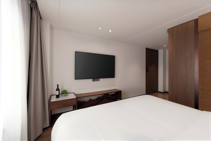 Imagen de la habitación del Hotel Luoyang Yunhuali. Foto 16