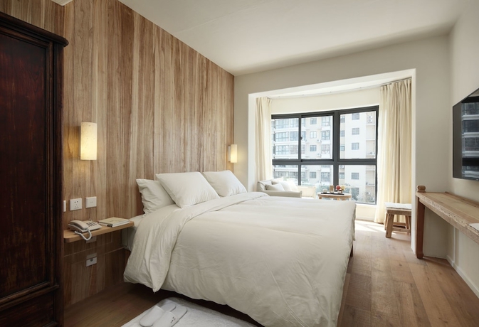 Imagen de la habitación del Hotel Luoyangyushe Boutique. Foto 4