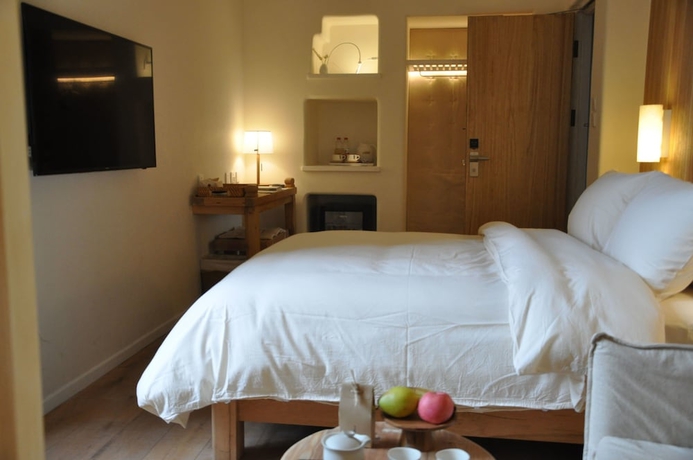 Imagen de la habitación del Hotel Luoyangyushe Boutique. Foto 11
