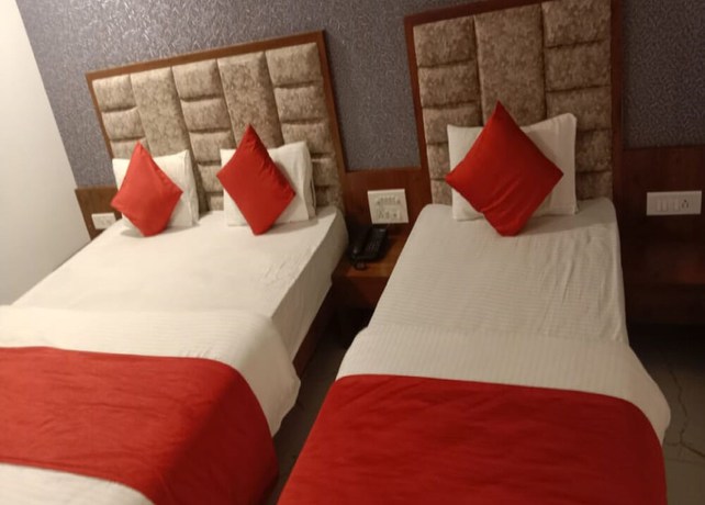 Imagen de la habitación del Hotel Lux Inn, Ahmedabad. Foto 18