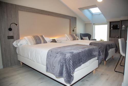Imagen de la habitación del Hotel Lux Melide. Foto 3