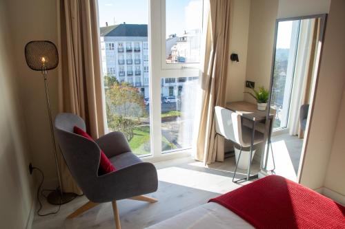Imagen de la habitación del Hotel Lux Melide. Foto 4