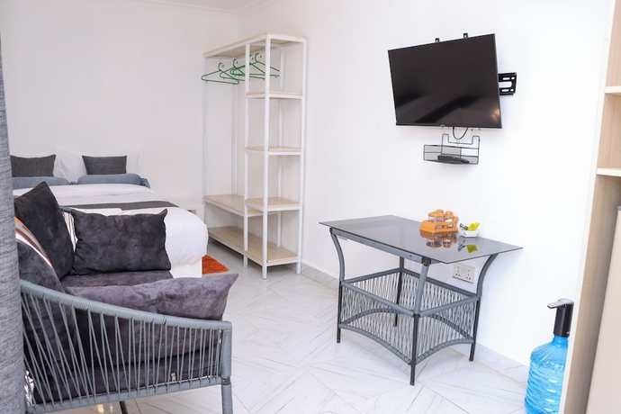Imagen de la habitación del Hotel Lux Suites Wild Wood Cottages Naivasha. Foto 5