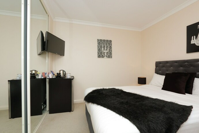 Imagen de la habitación del Hotel Luxe Spa on Kensington. Foto 14