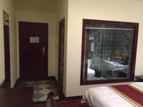 Imagen de la habitación del Hotel Luzhou Ba Li Nuo Theme. Foto 6