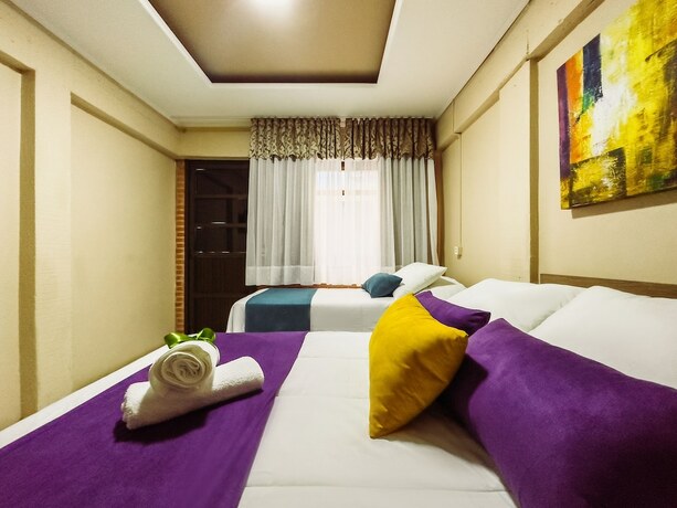 Imagen de la habitación del Hotel Luzzy. Foto 17