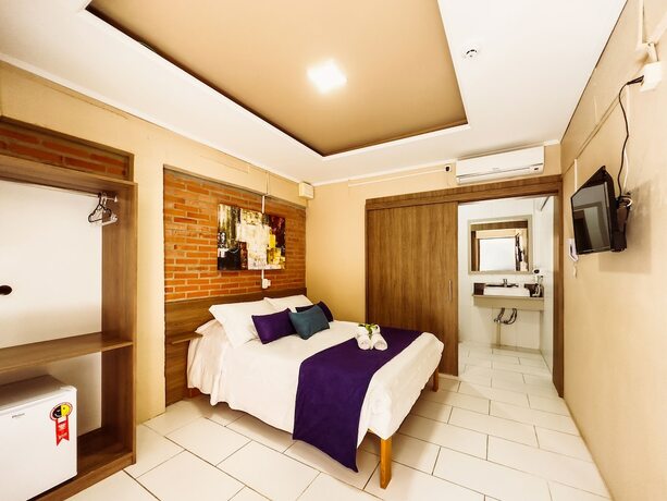 Imagen de la habitación del Hotel Luzzy. Foto 19