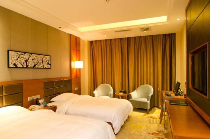 Imagen de la habitación del Hotel Lvbao Jin Hua Hotel. Foto 17