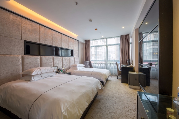 Imagen de la habitación del Hotel Lvgu Yiwu. Foto 2