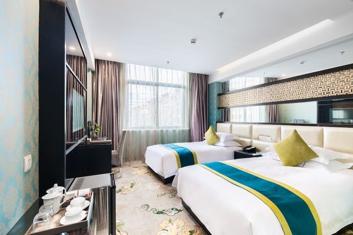 Imagen de la habitación del Hotel Lvgu Yiwu. Foto 17