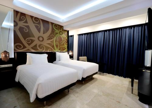 Imagen de la habitación del Hotel M Bahalap Palangka Raya. Foto 5