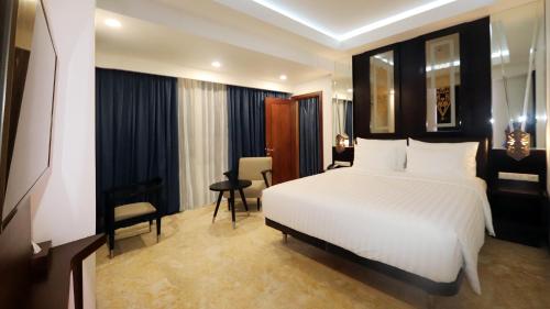 Imagen de la habitación del Hotel M Bahalap Palangka Raya. Foto 6