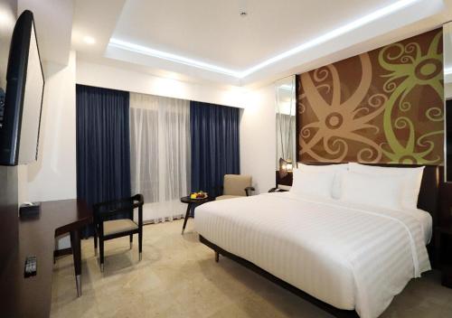 Imagen de la habitación del Hotel M Bahalap Palangka Raya. Foto 7