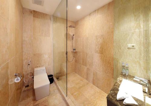 Imagen de la habitación del Hotel M Bahalap Palangka Raya. Foto 8