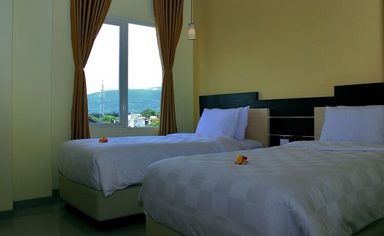 Imagen de la habitación del Hotel M, Cakranegara Utara. Foto 2