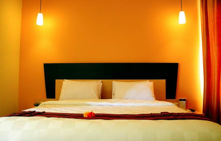 Imagen de la habitación del Hotel M, Cakranegara Utara. Foto 4