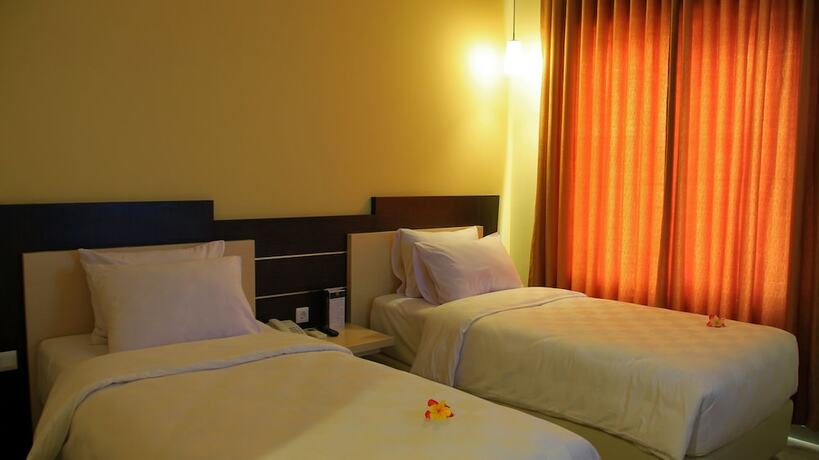 Imagen de la habitación del Hotel M, Cakranegara Utara. Foto 5