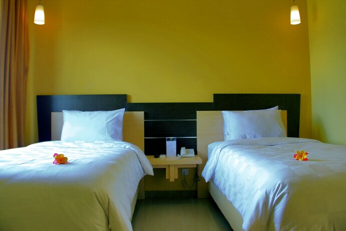 Imagen de la habitación del Hotel M, Cakranegara Utara. Foto 7